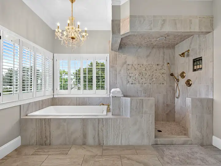 Primary bath with soaking tub and tile shower