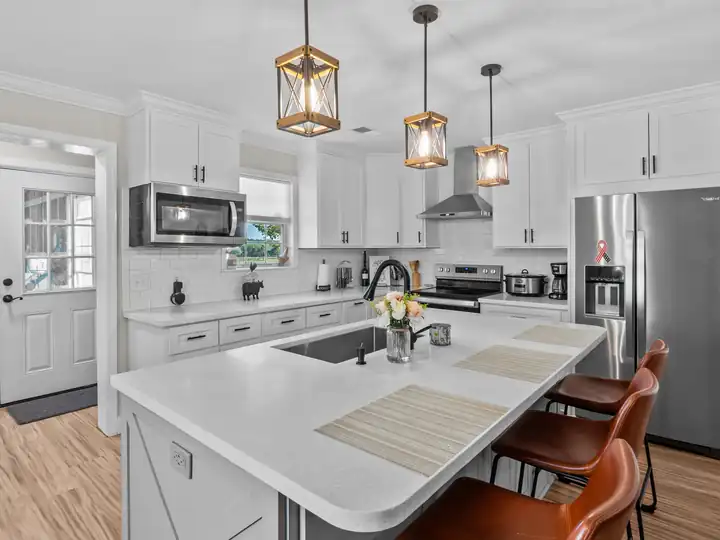 White kitchen with island seating